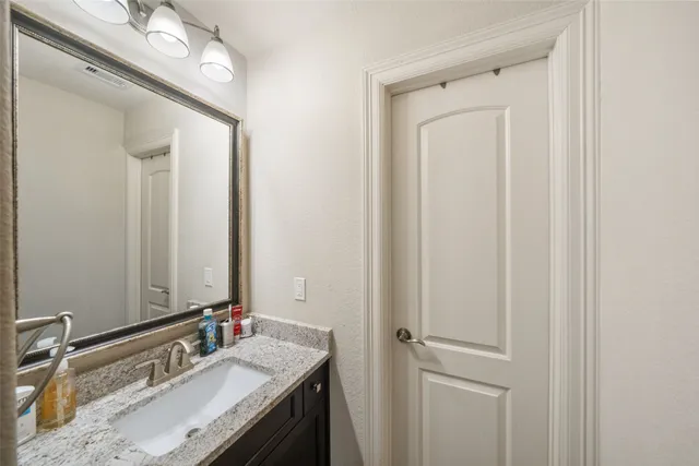 a view of a patio with a table chairs and a backyard