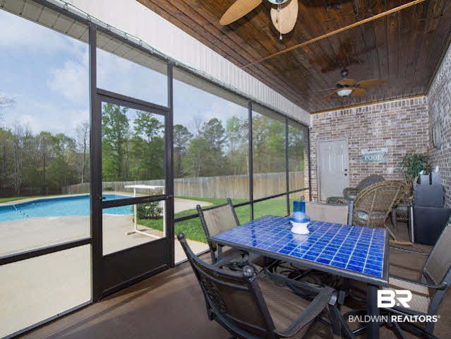 7814 Balin Drive Daphne, AL 36527 - Photo 22 of 26 Great Outdoor Living Area with a beautiful, wood-finished ceiling, ceiling fans, and an independant access to a full bathroom overlooks your pool paradise.
