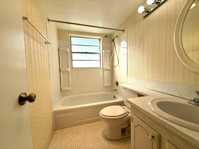 a bathroom with a sink a toilet and a bathtub