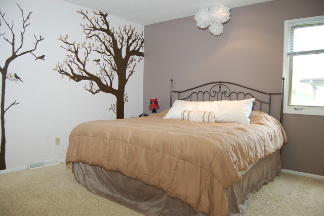 3817 Cutty Sark Road Cherry Valley, IL 61016 - Photo 7 of 15 a bedroom with a bed and a chandelier