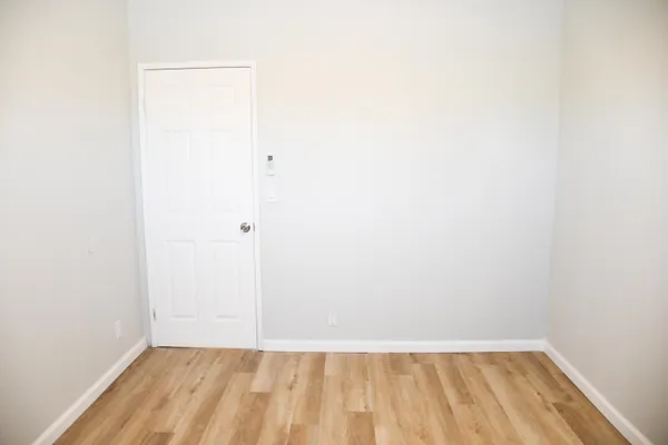 a view of a small space with wooden floor