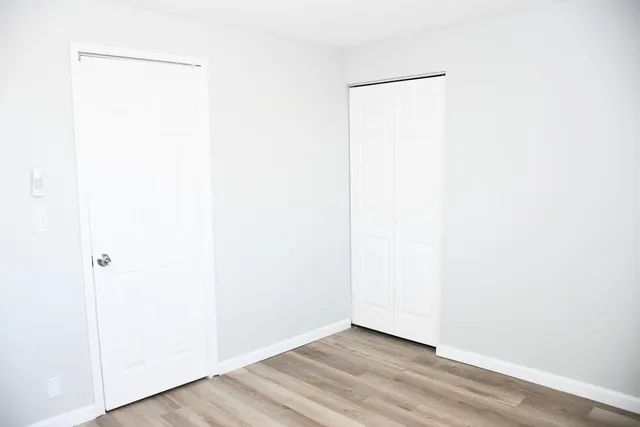 a view of a small space with wooden floor