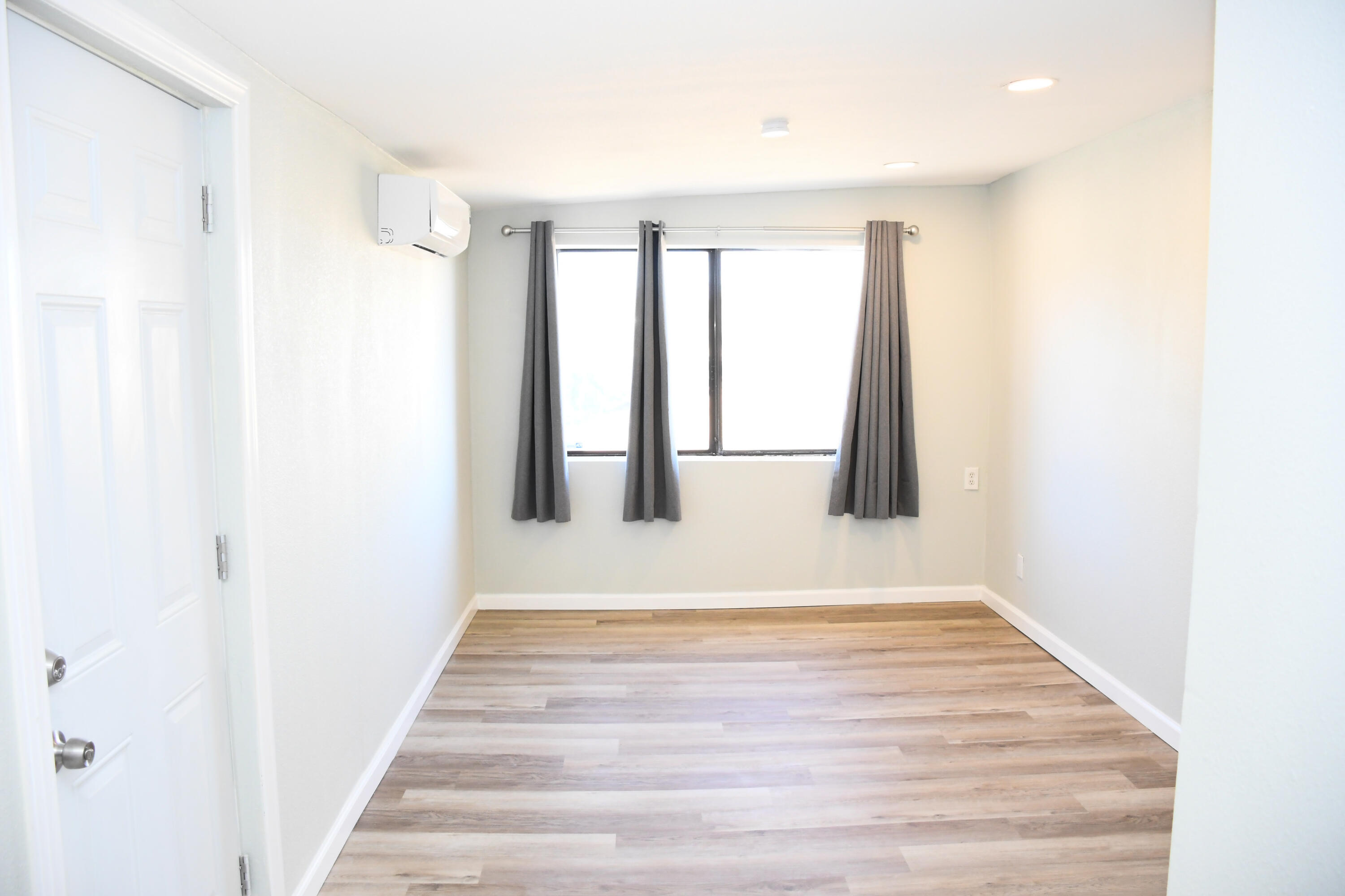 61576 Aberdeen Drive Joshua Tree, CA 92252 - Photo 27 of 31 a view of an empty room with wooden floor
