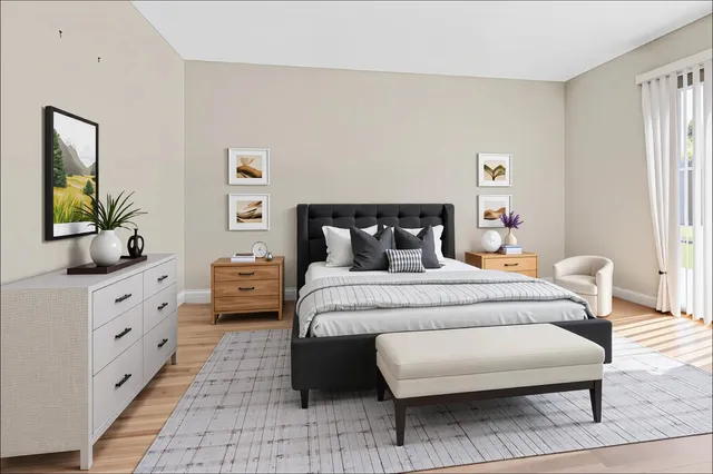 a bedroom with a bed and a dresser in it