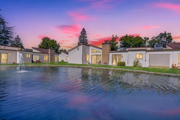 front view of a house with a lake view