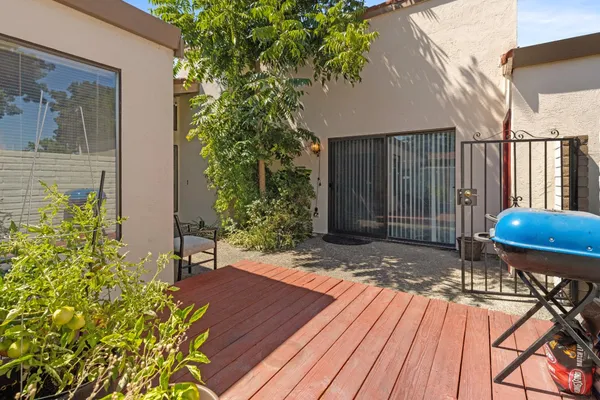 a view of a backyard with sitting area