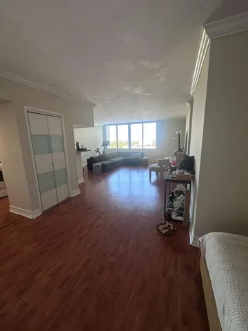 a view of a room with gym equipment and a window