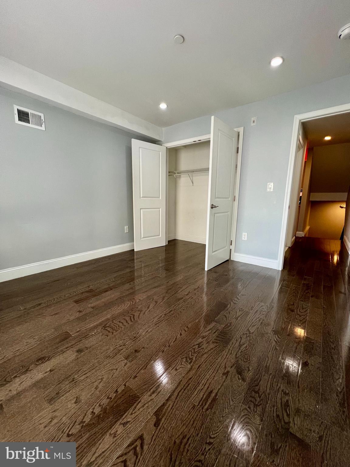 1703 South 22nd Street, Unit 1 Philadelphia, PA 19145 - Photo 13 of 27 a view of an empty room with wooden floor