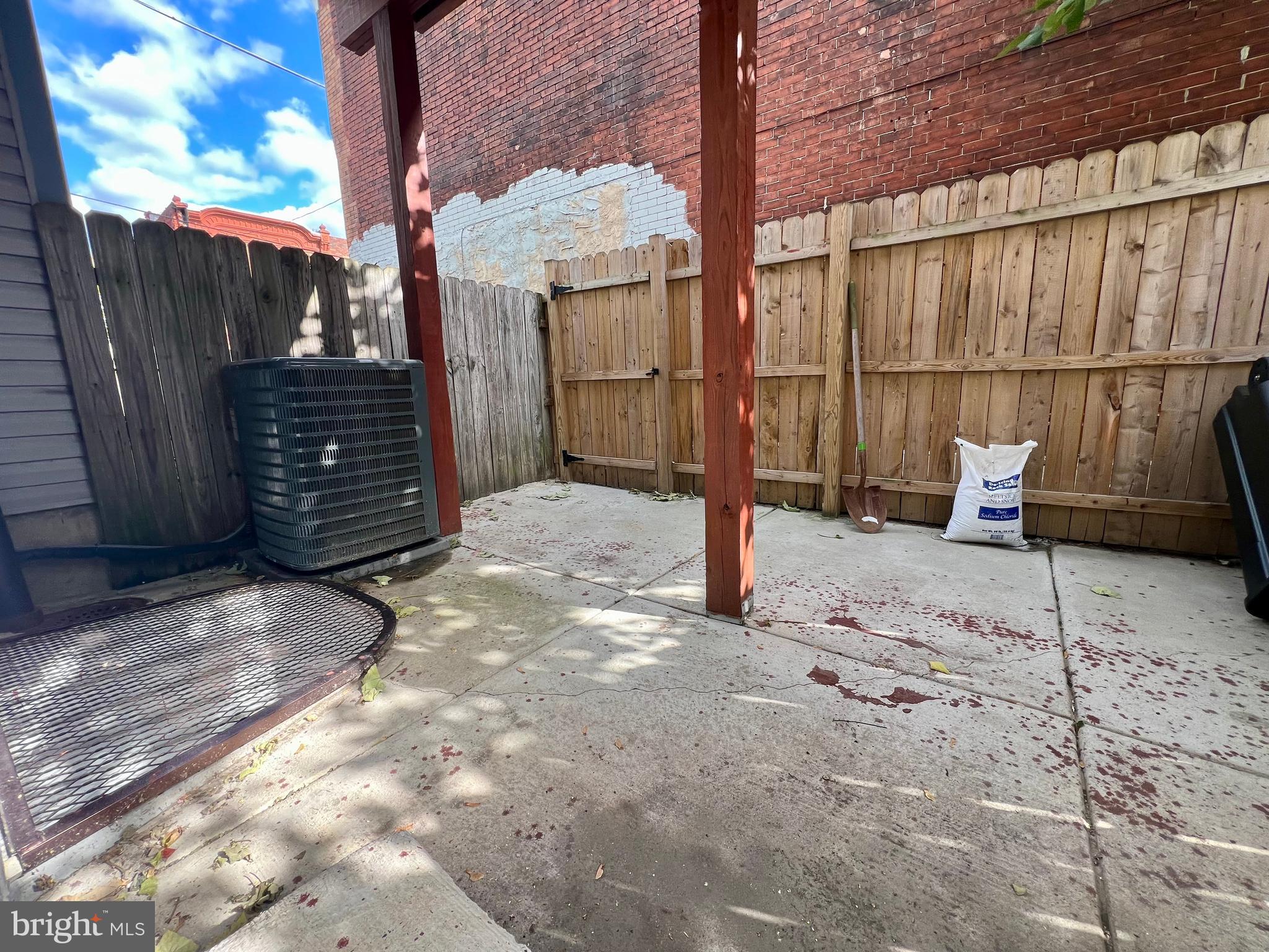 1703 South 22nd Street, Unit 1 Philadelphia, PA 19145 - Photo 27 of 27 a view of backyard with wooden fence