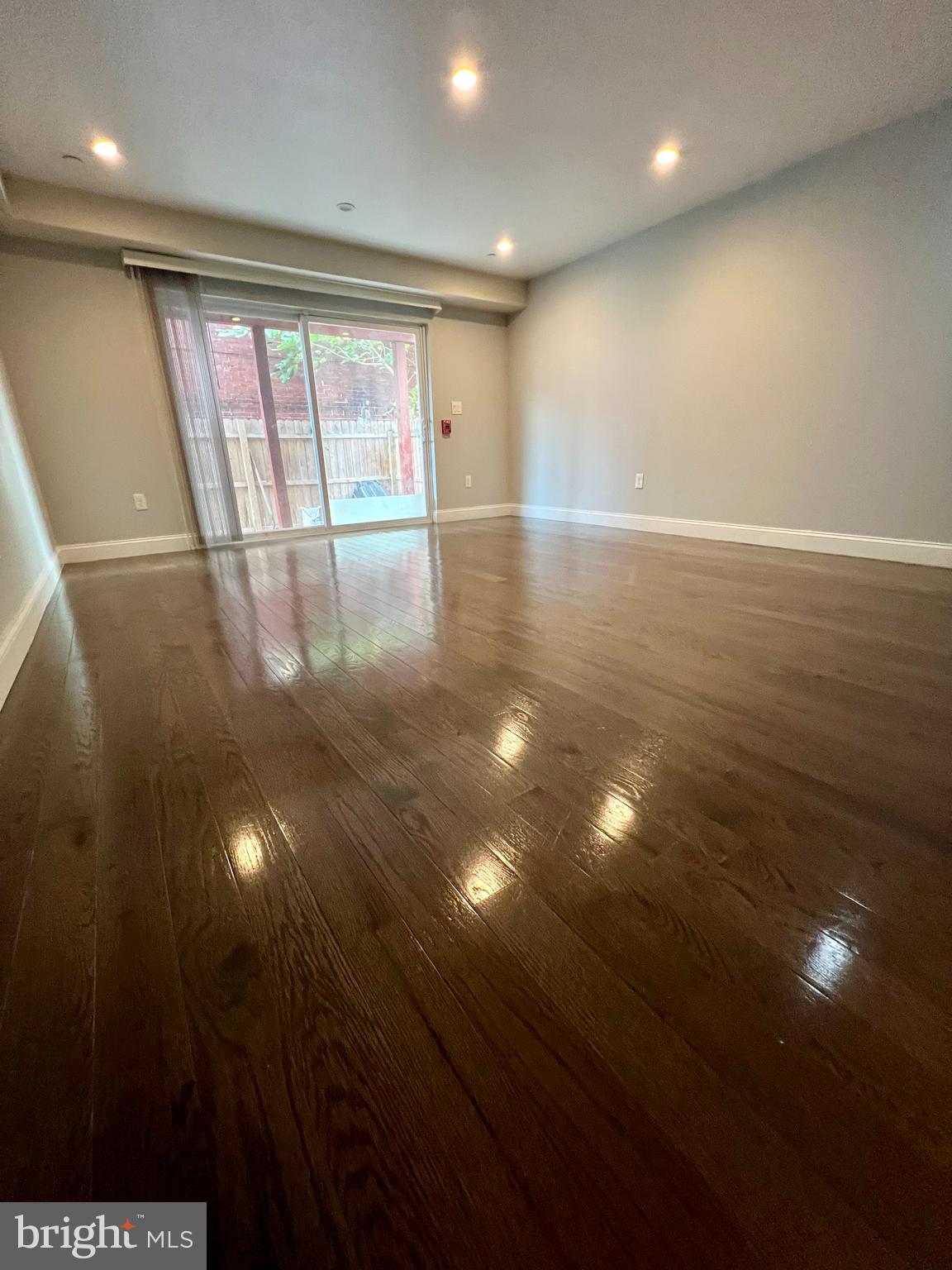 1703 South 22nd Street, Unit 1 Philadelphia, PA 19145 - Photo 5 of 27 a view of an empty room with wooden floor
