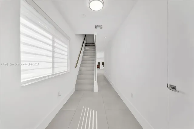 a view of a hallway with windows