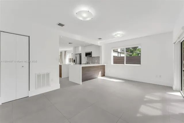 a view of a kitchen with a sink cabinets and a window