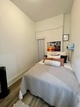 a bedroom with a bed and furniture