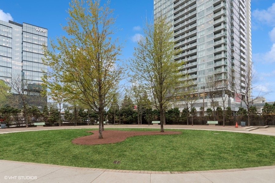 660 West Wayman Street, Unit 701 Chicago, IL 60661 - Photo 19 of 23 a front view of a building with large trees