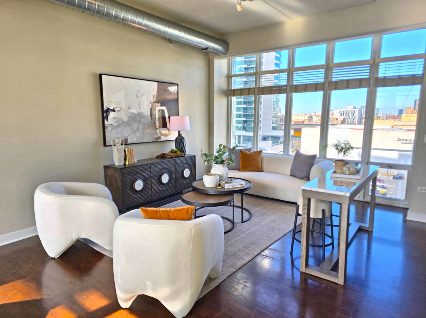 660 West Wayman Street, Unit 701 Chicago, IL 60661 - Photo 5 of 23 a living room with furniture and a floor to ceiling window