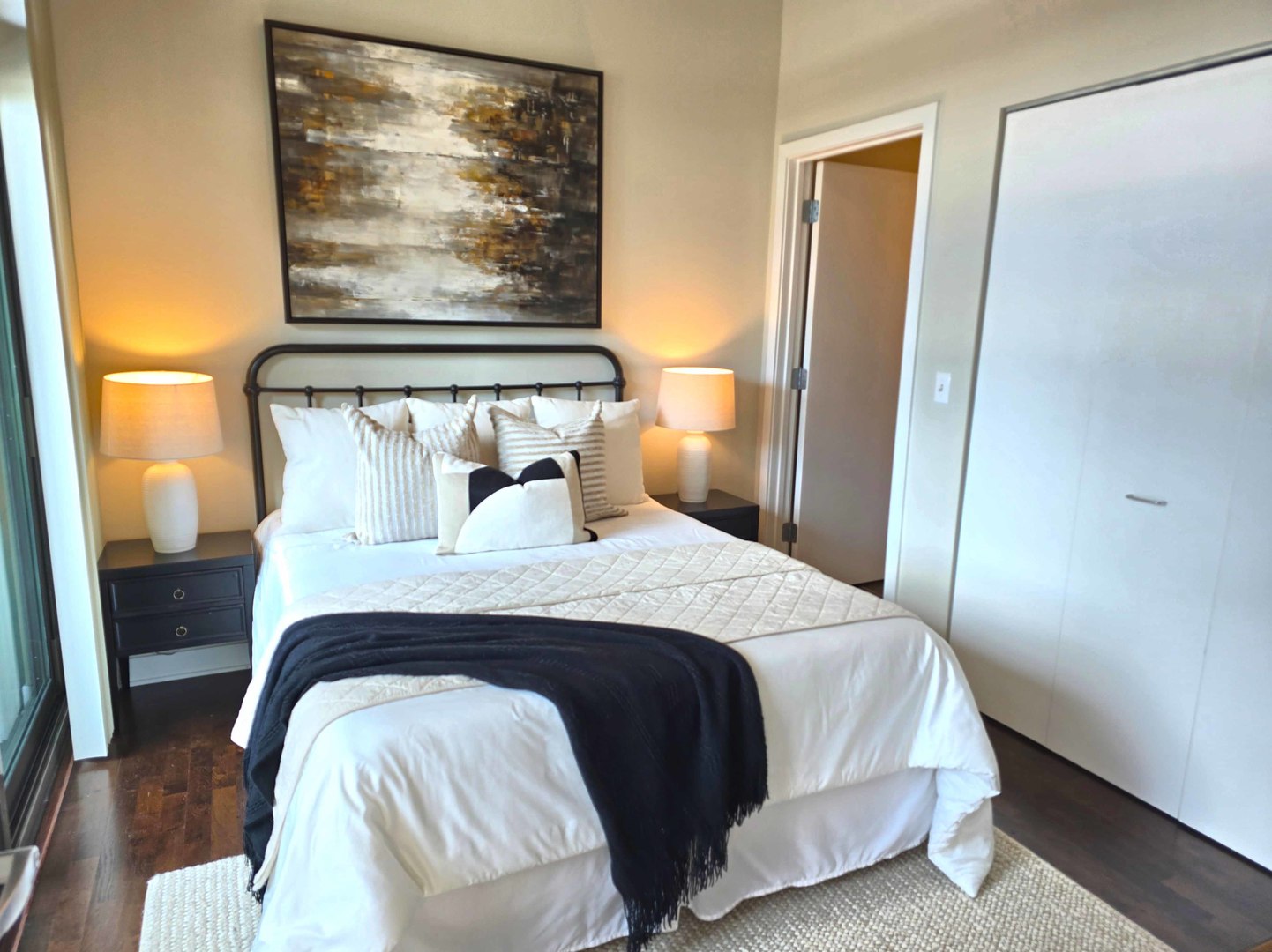 660 West Wayman Street, Unit 701 Chicago, IL 60661 - Photo 9 of 23 a bedroom with a bed and wooden floor