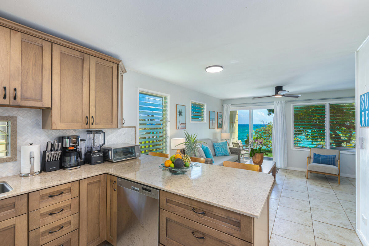 380 Papaloa Road, Unit 2 Kapaa, HI 96746 - Photo 12 of 20 a kitchen with a large window appliances and cabinets