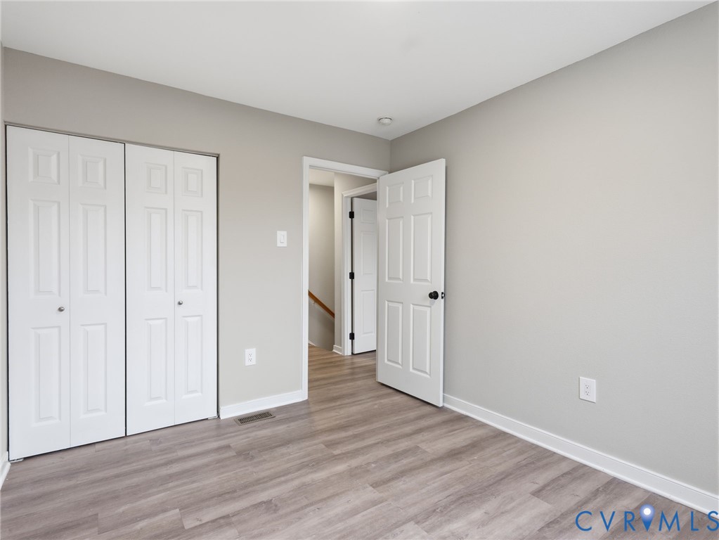 3530 East Richmond Road, Unit U15 Richmond, VA 23223 - Photo 12 of 18 a view of a hallway with wooden floor