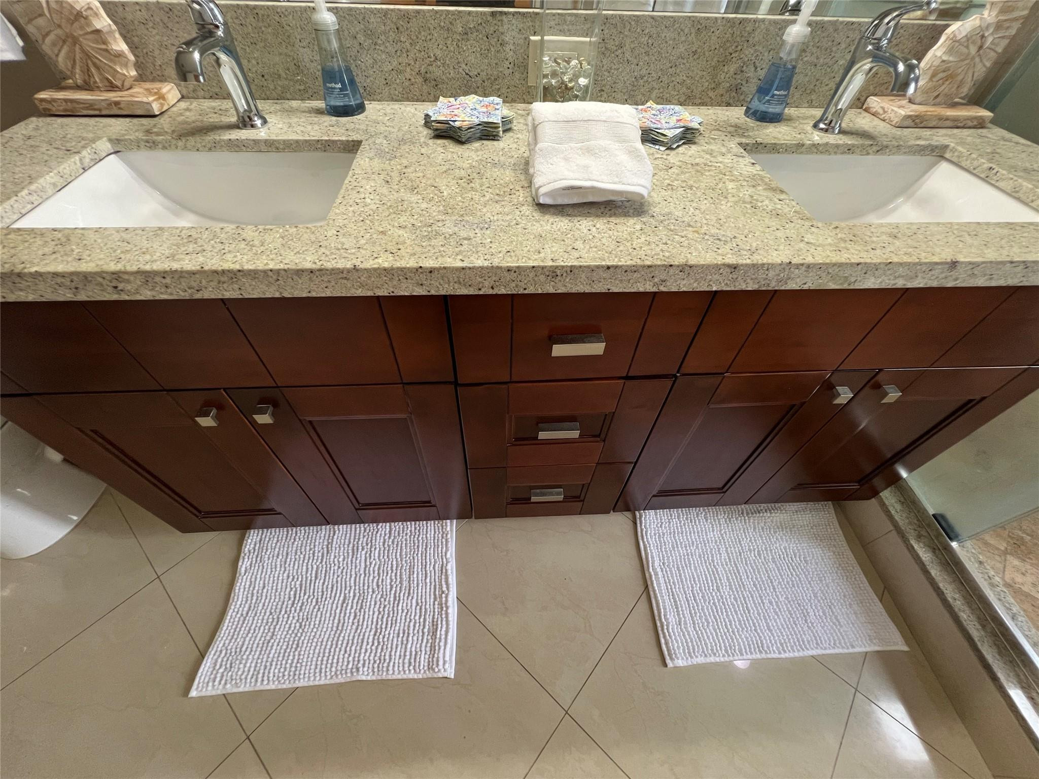 9300 Southwest 8th Street, Unit 108 Boca Raton, FL 33428 - Photo 14 of 40 a bathroom with a granite countertop sink