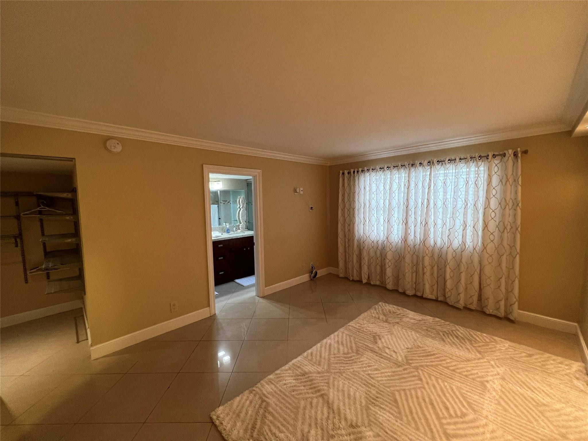 9300 Southwest 8th Street, Unit 108 Boca Raton, FL 33428 - Photo 20 of 40 an empty room with windows