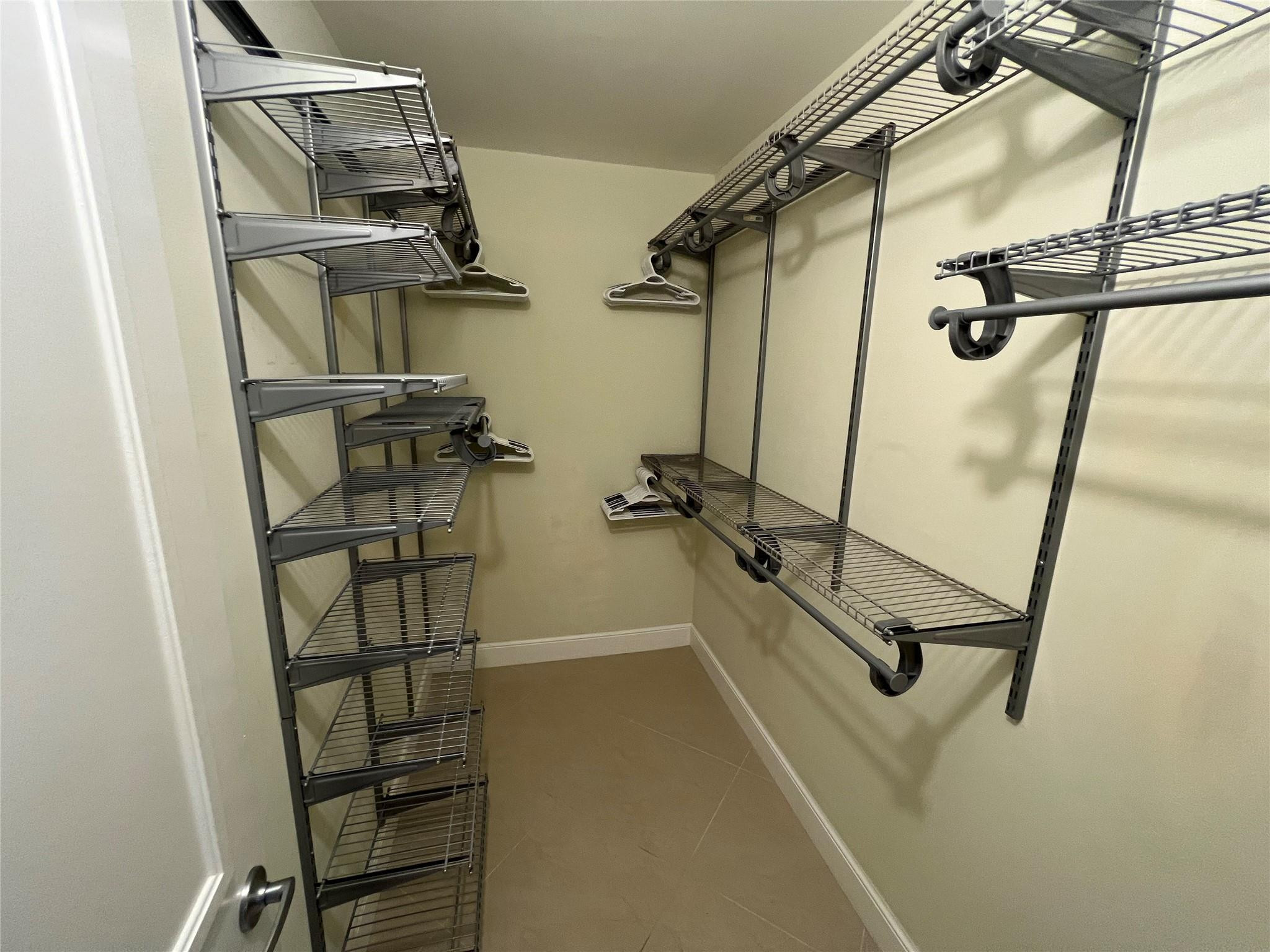 9300 Southwest 8th Street, Unit 108 Boca Raton, FL 33428 - Photo 21 of 40 a view of a room with rack on the wall