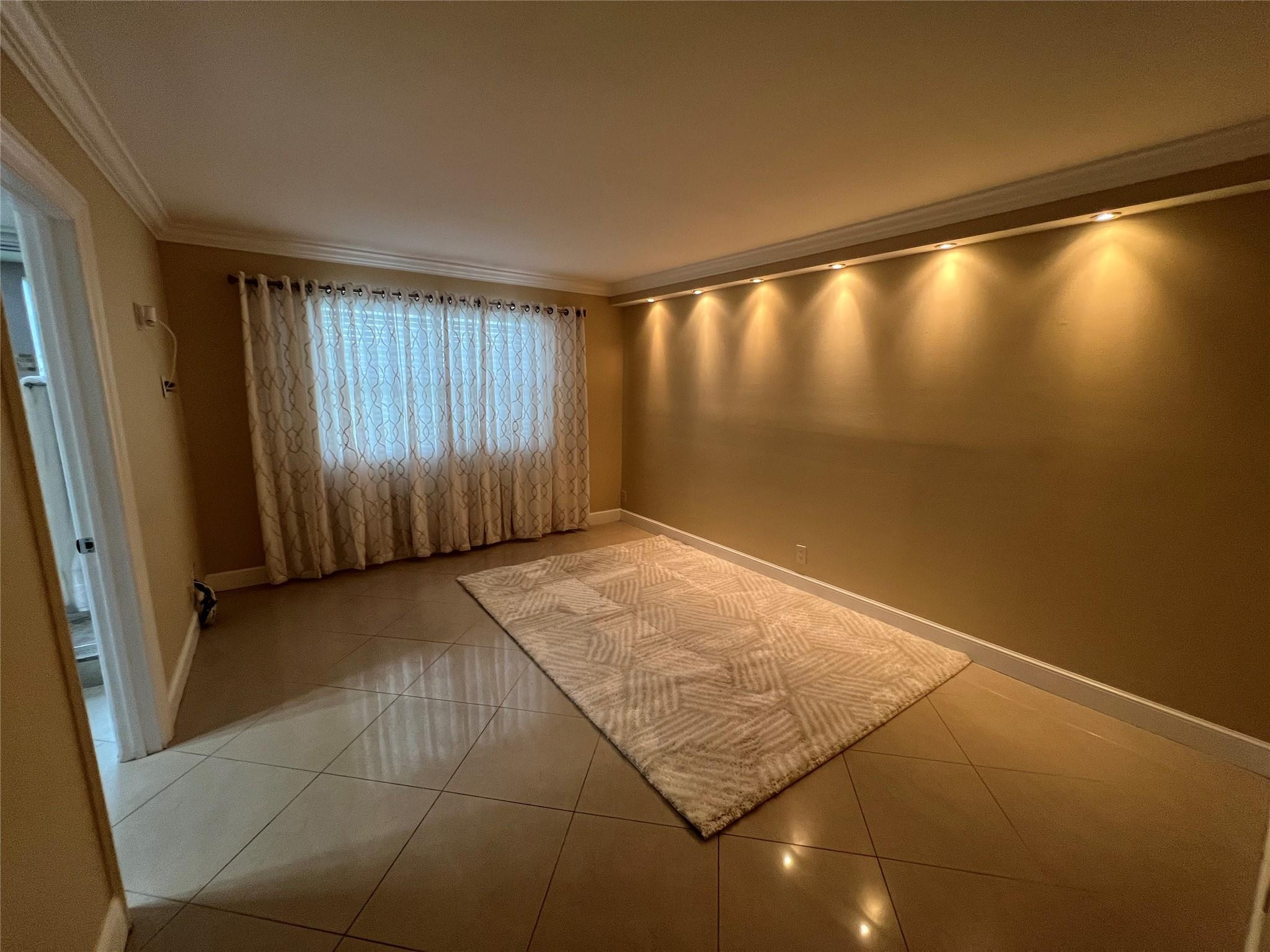 9300 Southwest 8th Street, Unit 108 Boca Raton, FL 33428 - Photo 22 of 40 a view of an empty room with a window