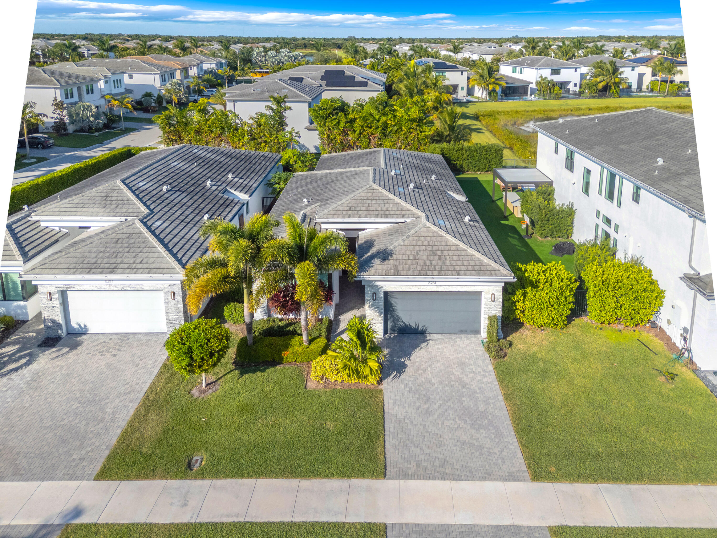 8281 Oceanus Drive Boca Raton, FL 33496 - Photo 19 of 52 an aerial view of a house with a garden