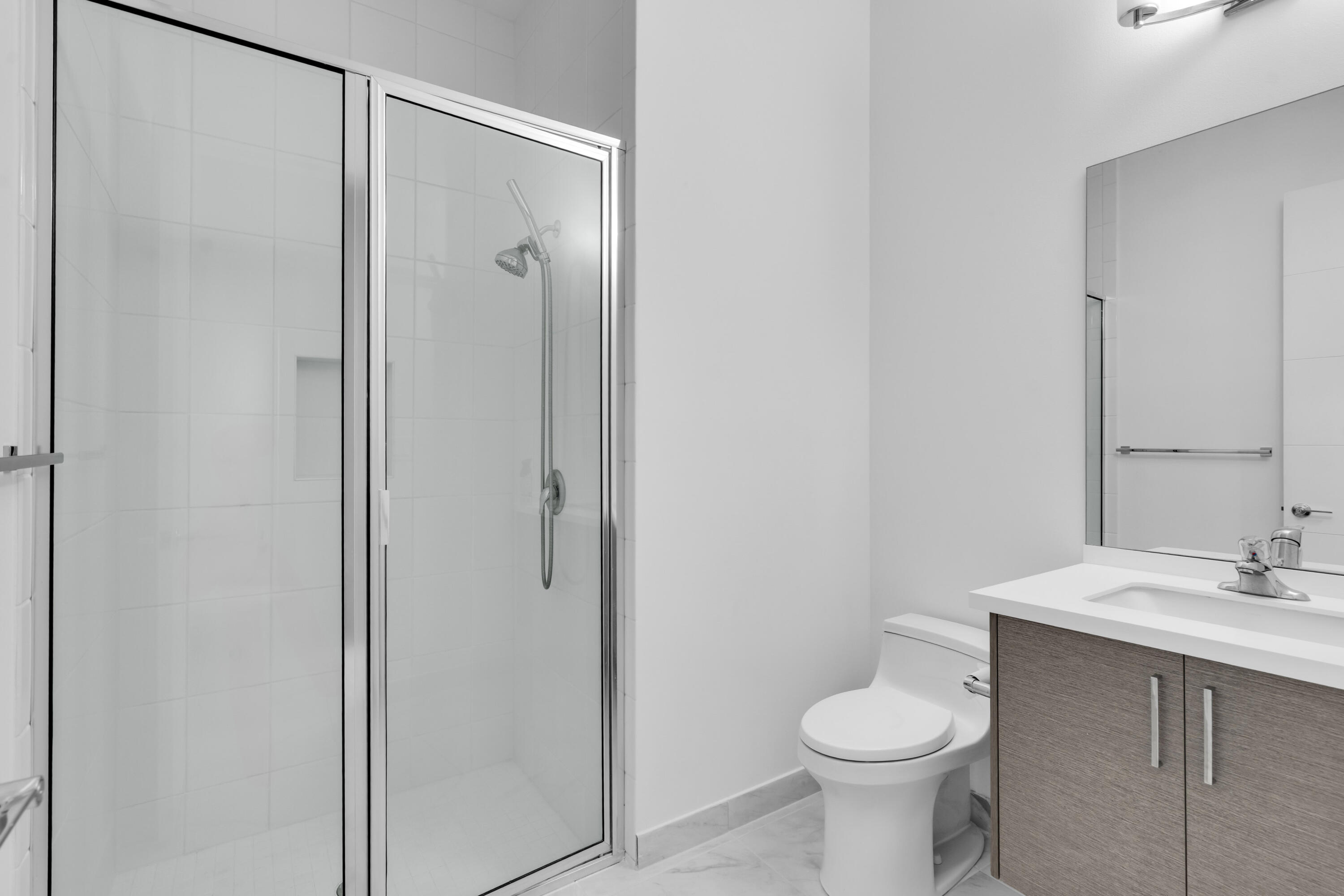 8281 Oceanus Drive Boca Raton, FL 33496 - Photo 27 of 52 a bathroom with a sink toilet and shower