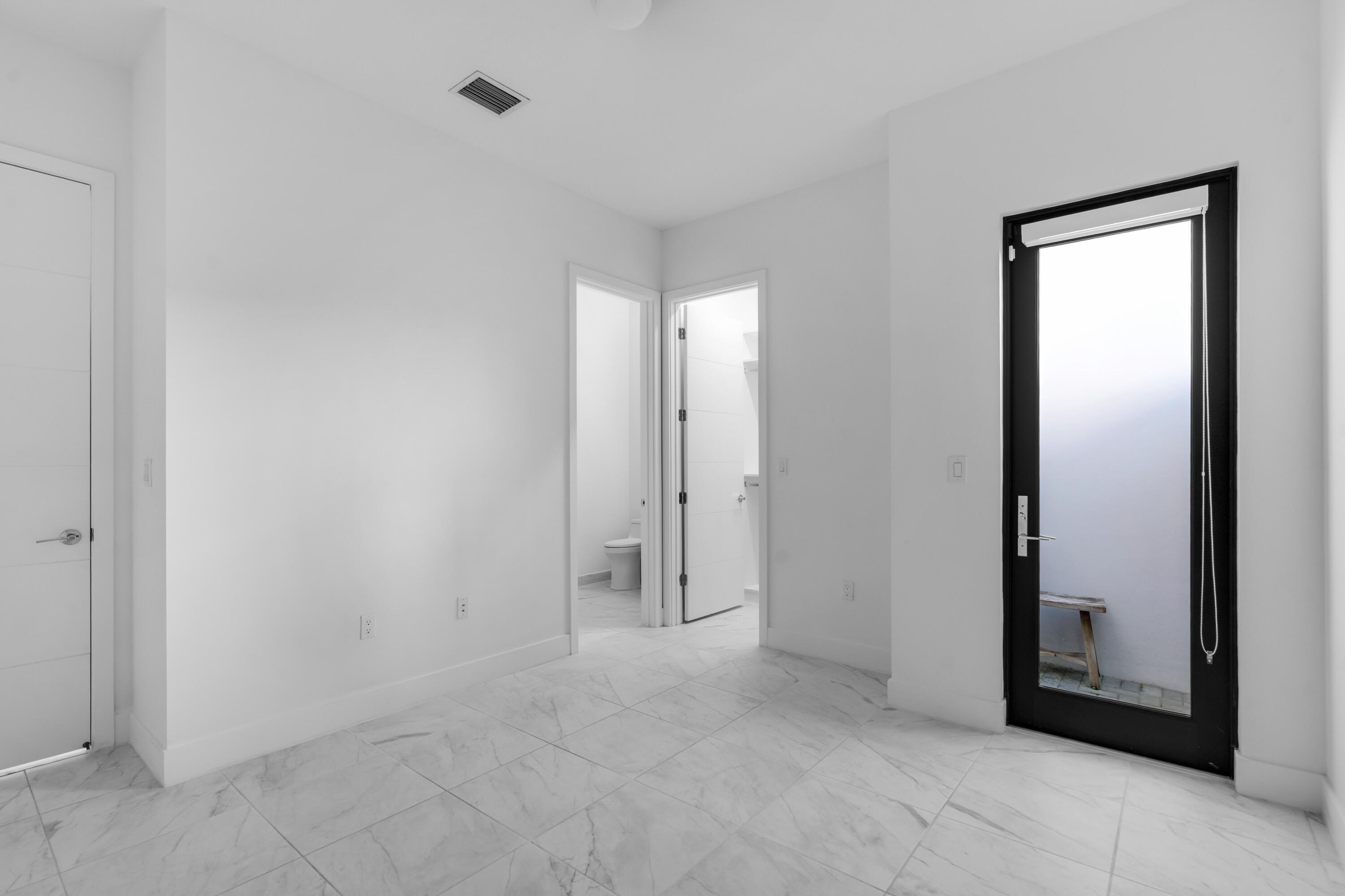 8281 Oceanus Drive Boca Raton, FL 33496 - Photo 28 of 52 an empty room with mirror in closet