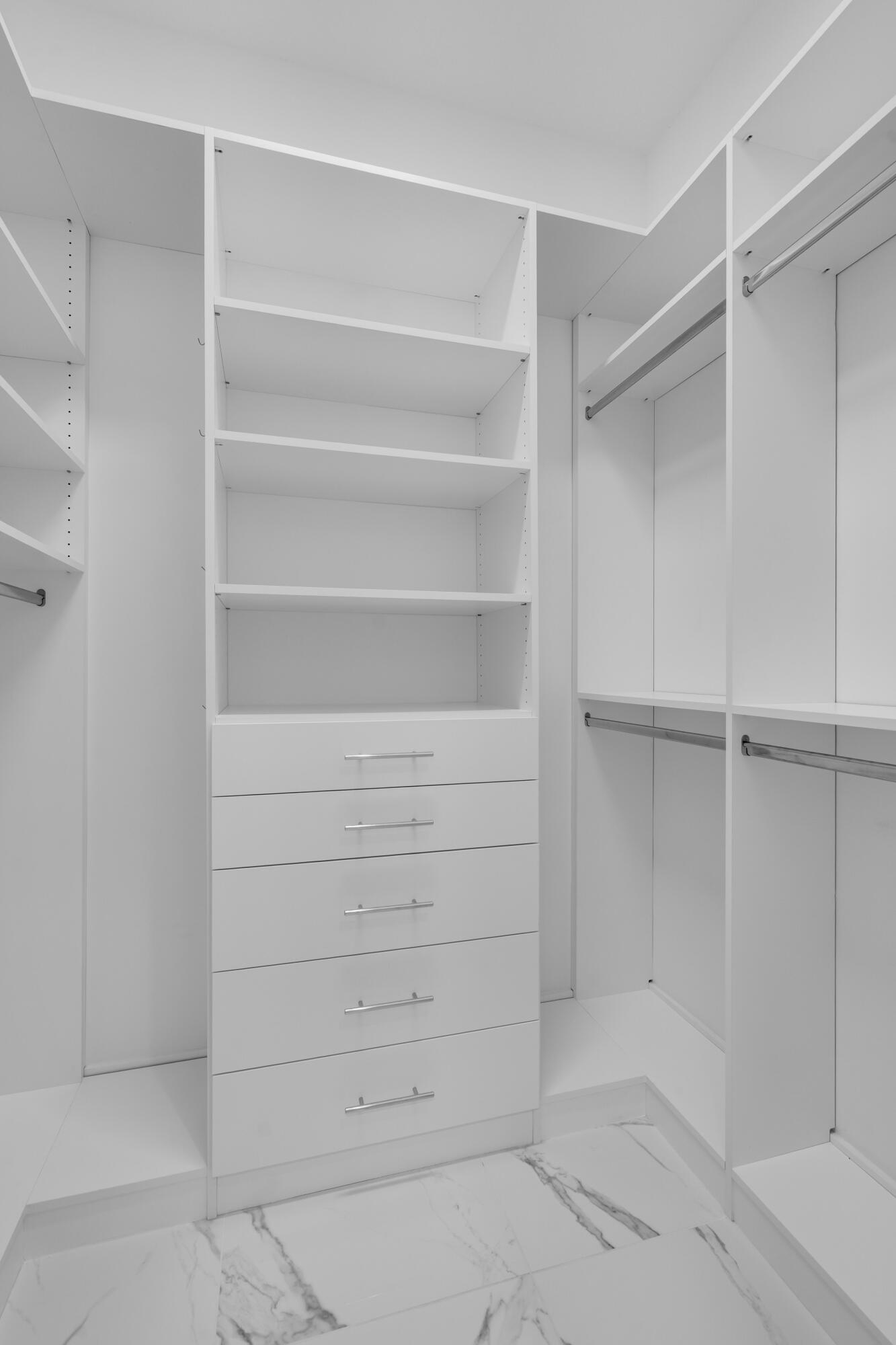 8281 Oceanus Drive Boca Raton, FL 33496 - Photo 31 of 52 a view of walk in closet with empty racks