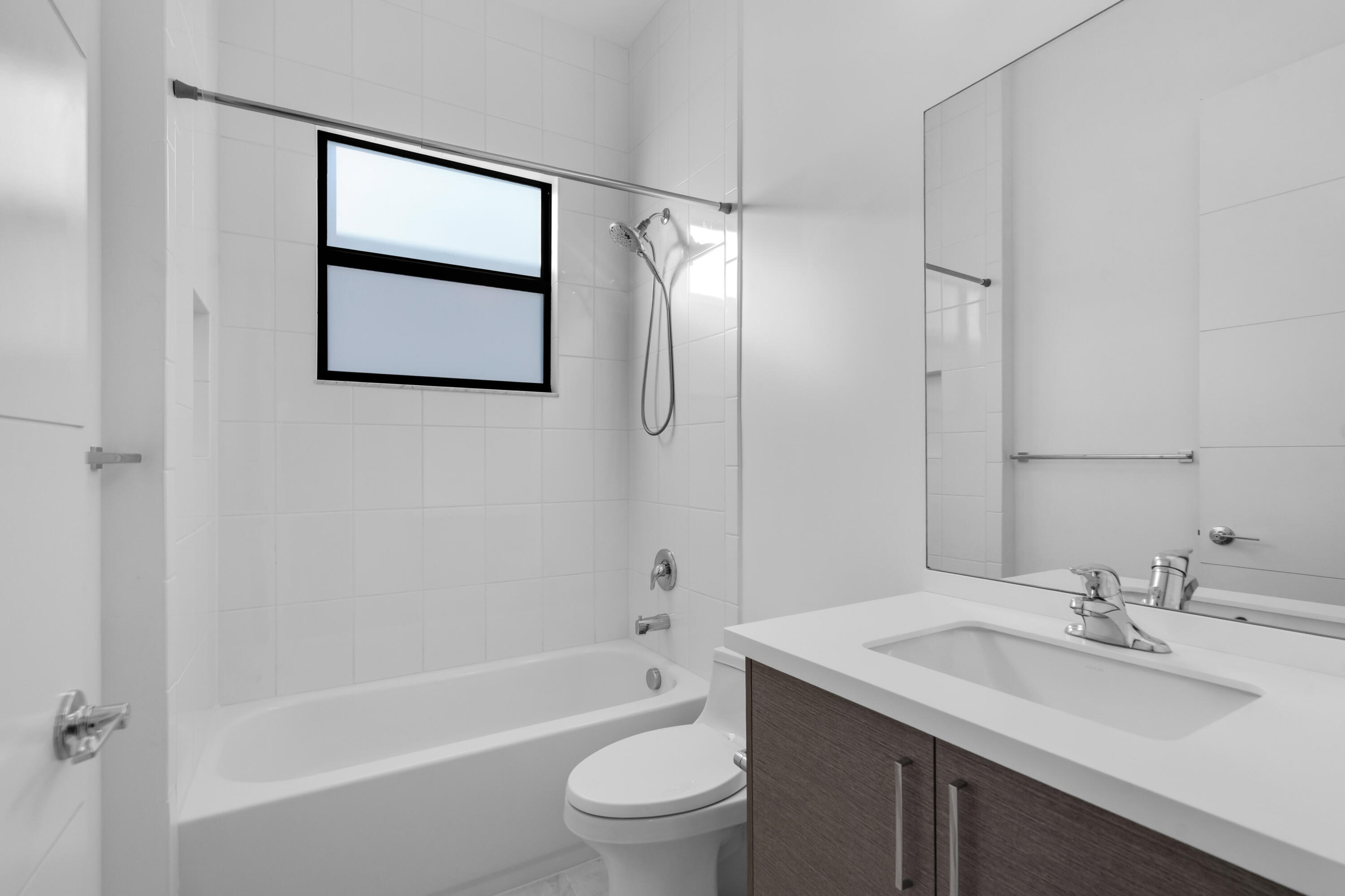 8281 Oceanus Drive Boca Raton, FL 33496 - Photo 36 of 52 a bathroom with a sink toilet and shower