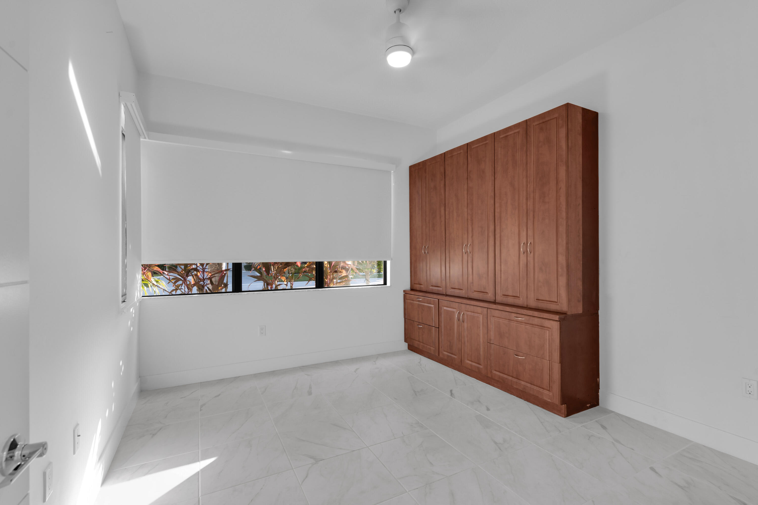 8281 Oceanus Drive Boca Raton, FL 33496 - Photo 38 of 52 a white refrigerator freezer sitting in a kitchen