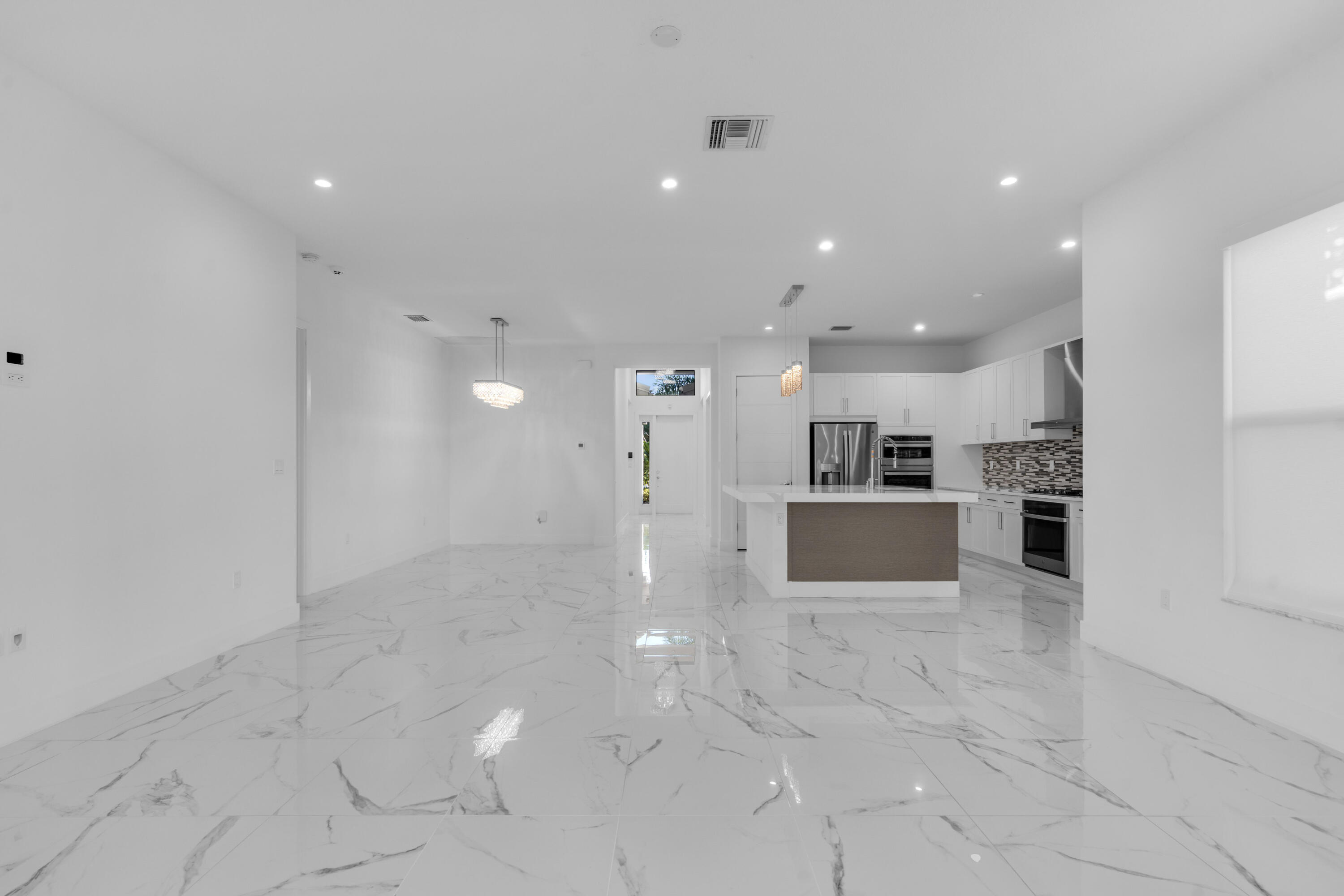 8281 Oceanus Drive Boca Raton, FL 33496 - Photo 40 of 52 a view of kitchen with kitchen island and stainless steel appliances