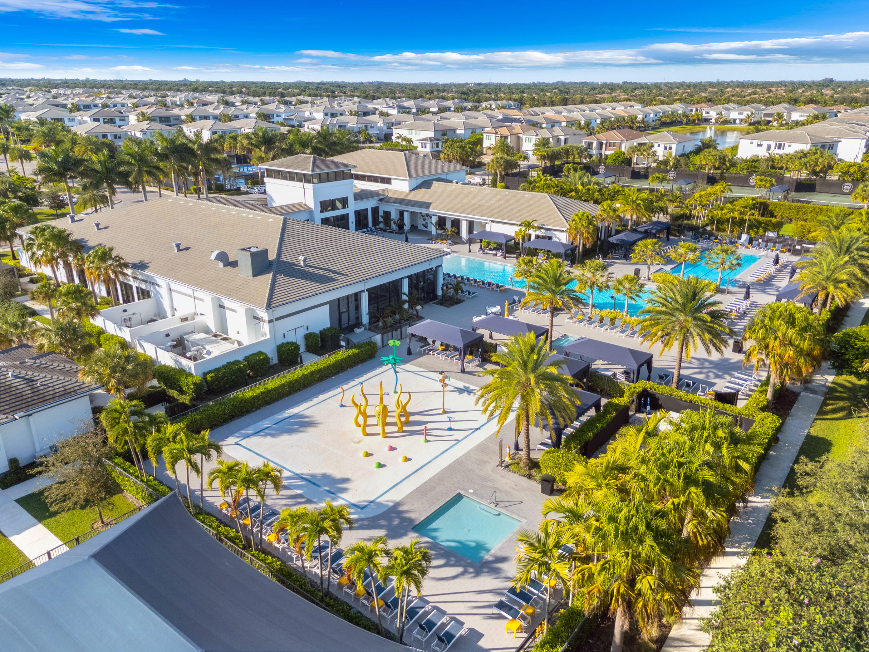 8281 Oceanus Drive Boca Raton, FL 33496 - Photo 4 of 52 an aerial view of a residential building and lake view