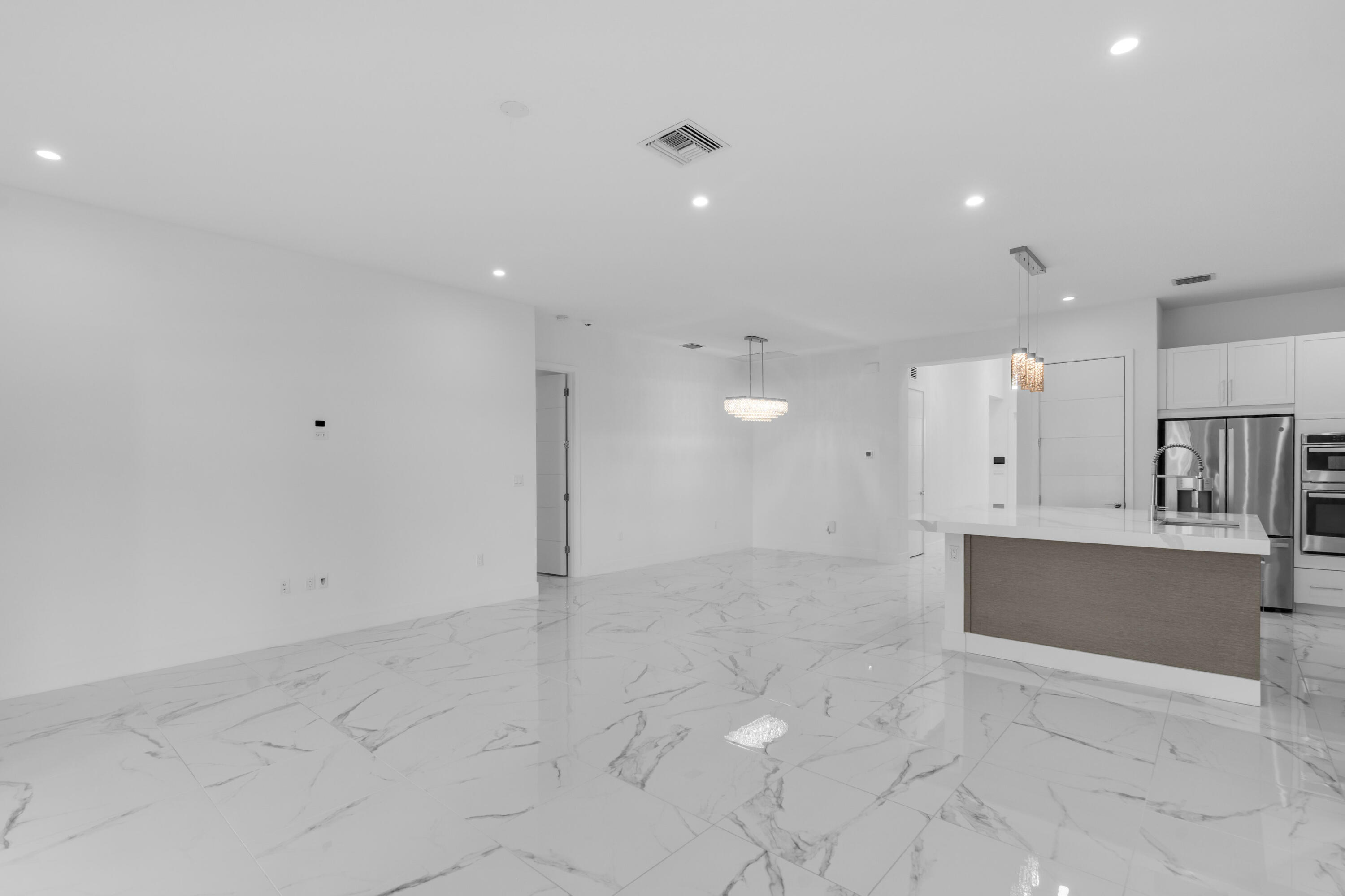 8281 Oceanus Drive Boca Raton, FL 33496 - Photo 46 of 52 a view of kitchen with kitchen island a sink appliances and cabinets