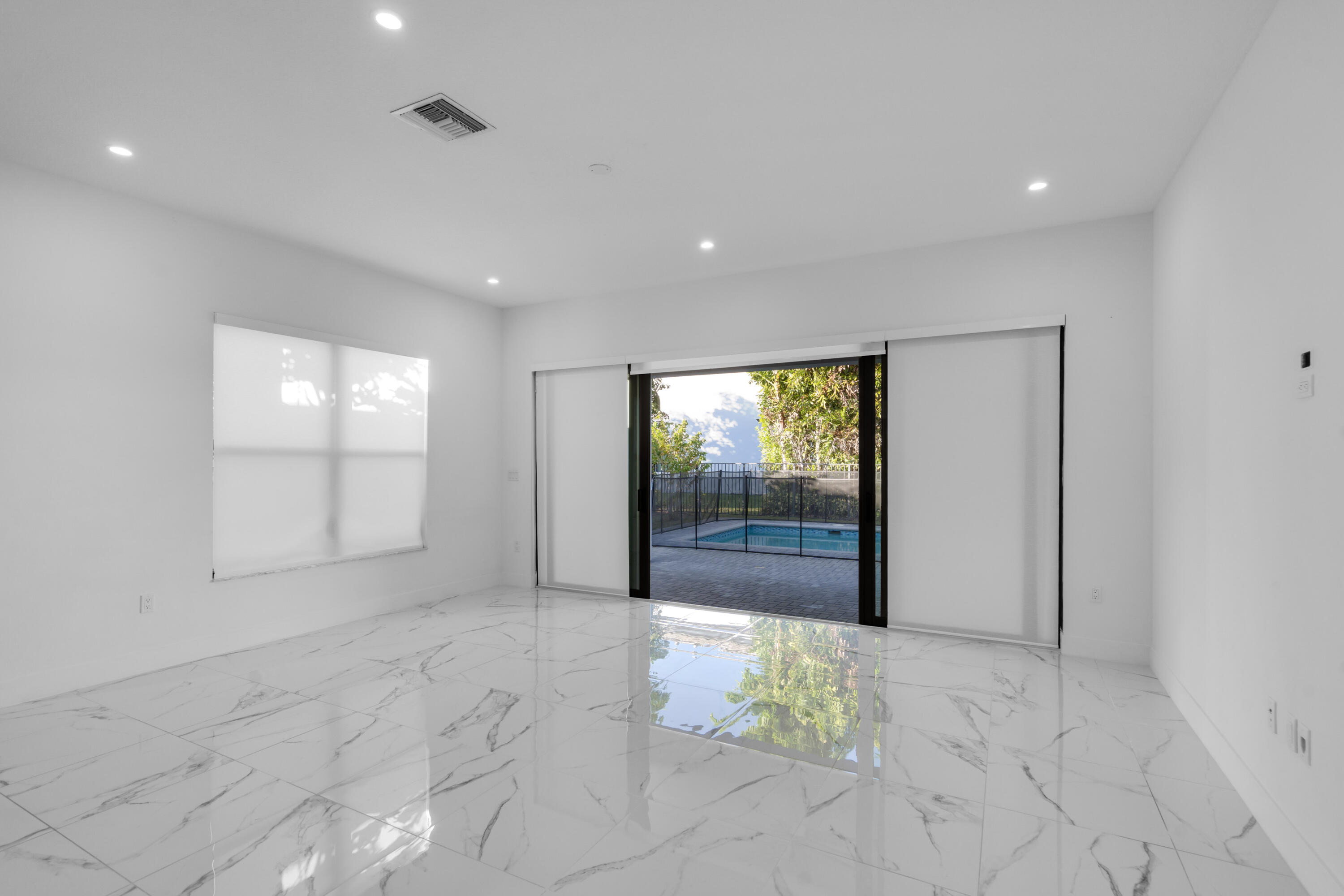 8281 Oceanus Drive Boca Raton, FL 33496 - Photo 47 of 52 a view of an empty room and window