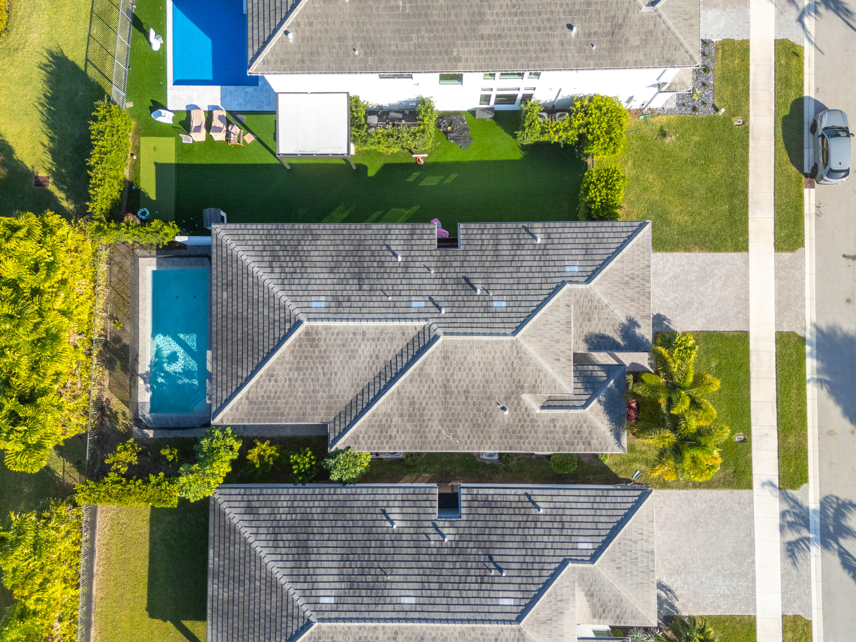 8281 Oceanus Drive Boca Raton, FL 33496 - Photo 9 of 52 an aerial view of a house with a garden and plants
