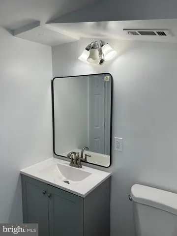 a bathroom with a sink and mirror
