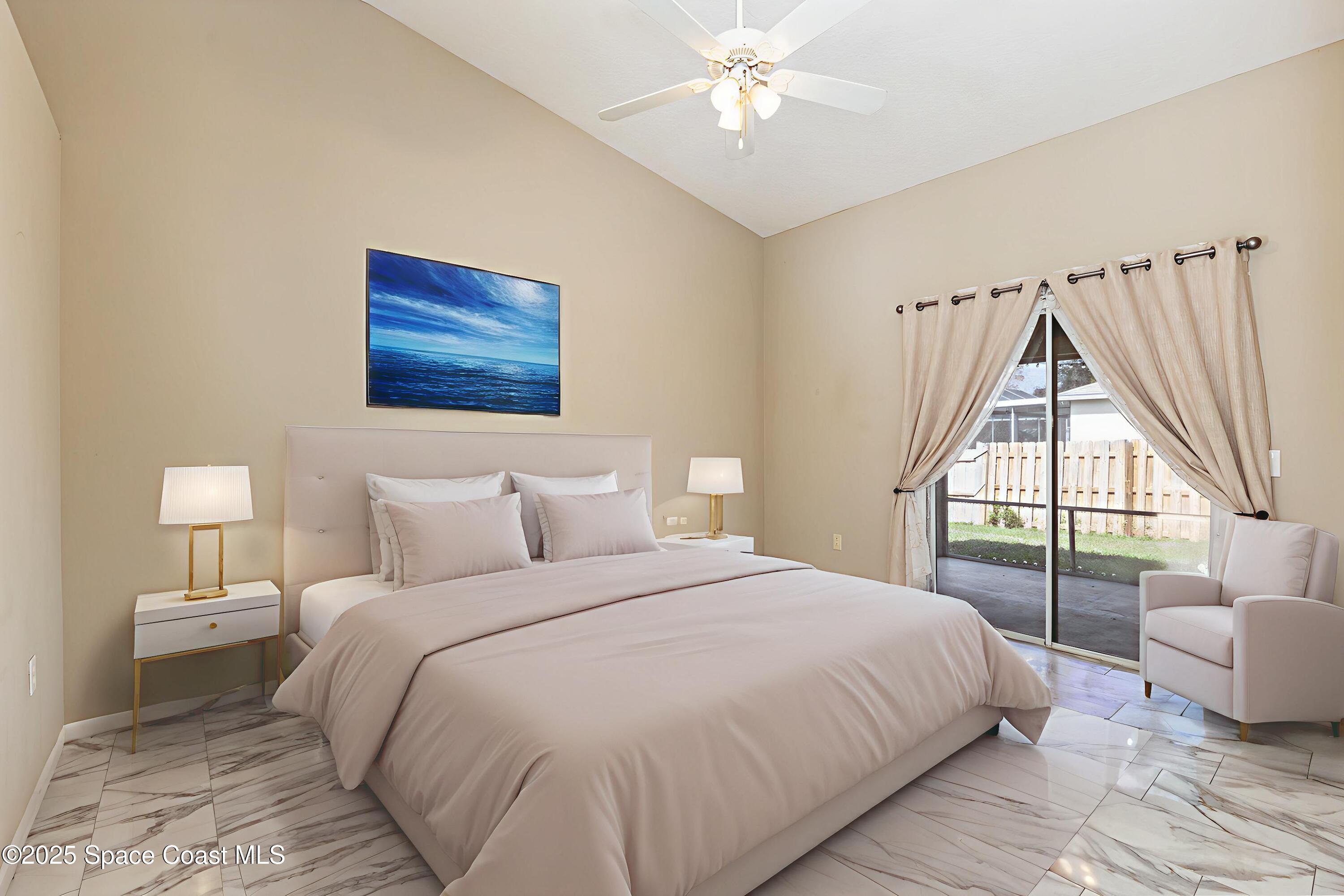 6480 Annapolis Street Cocoa, FL 32927 - Photo 14 of 30 a bedroom with a large bed and a window