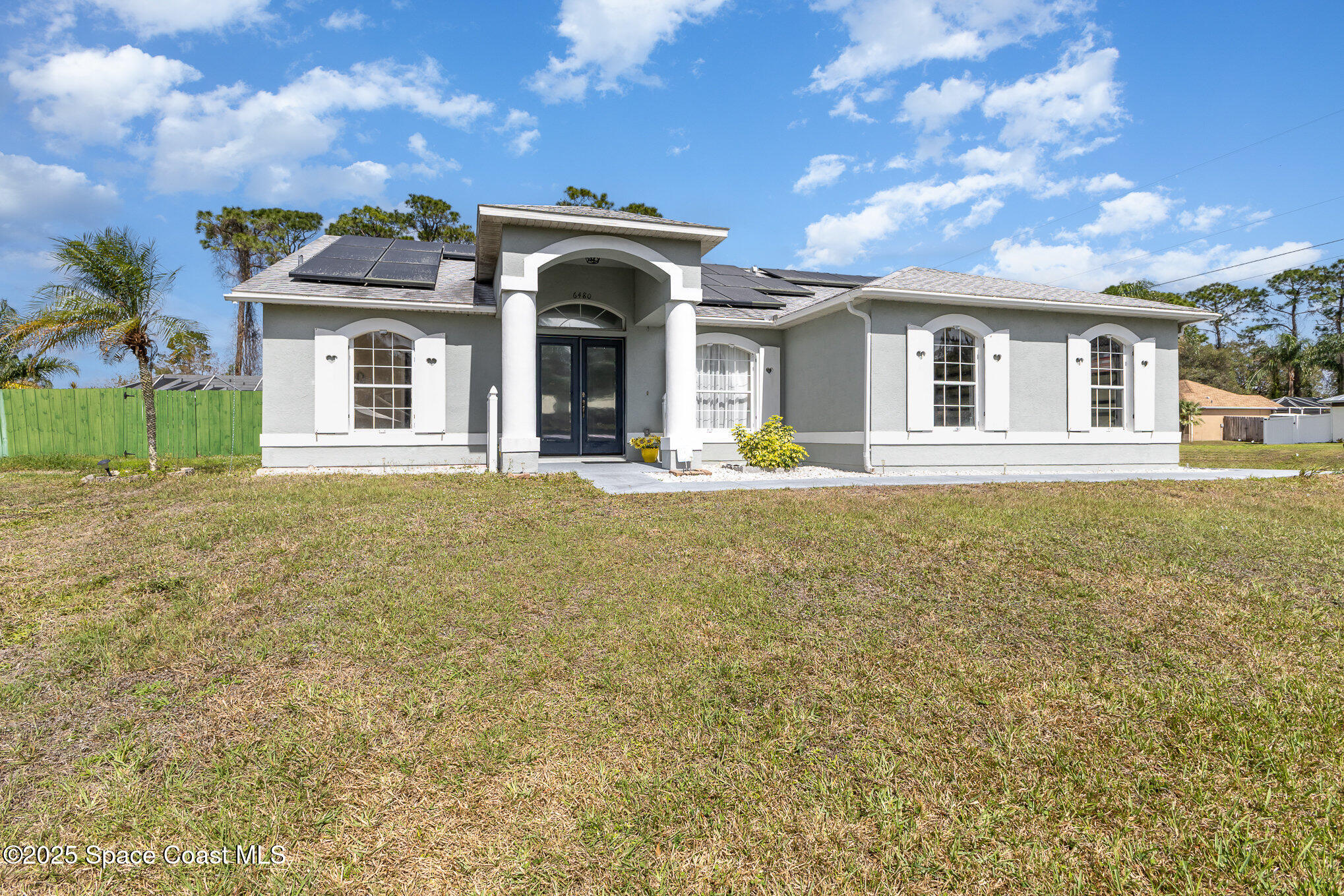 6480 Annapolis Street Cocoa, FL 32927 - Photo 2 of 30 a front view of a house with a yard