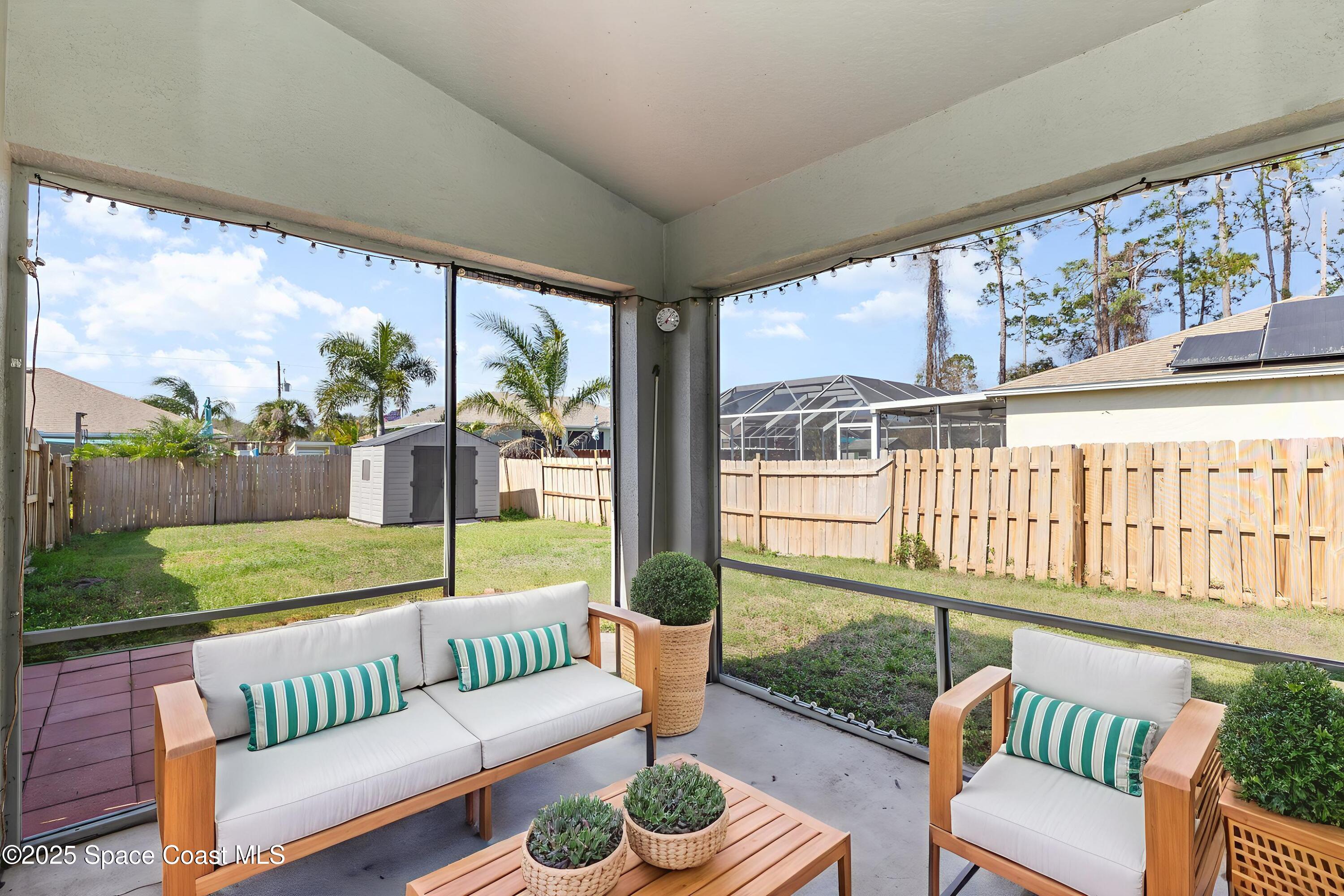 6480 Annapolis Street Cocoa, FL 32927 - Photo 26 of 30 a balcony with furniture and garden view