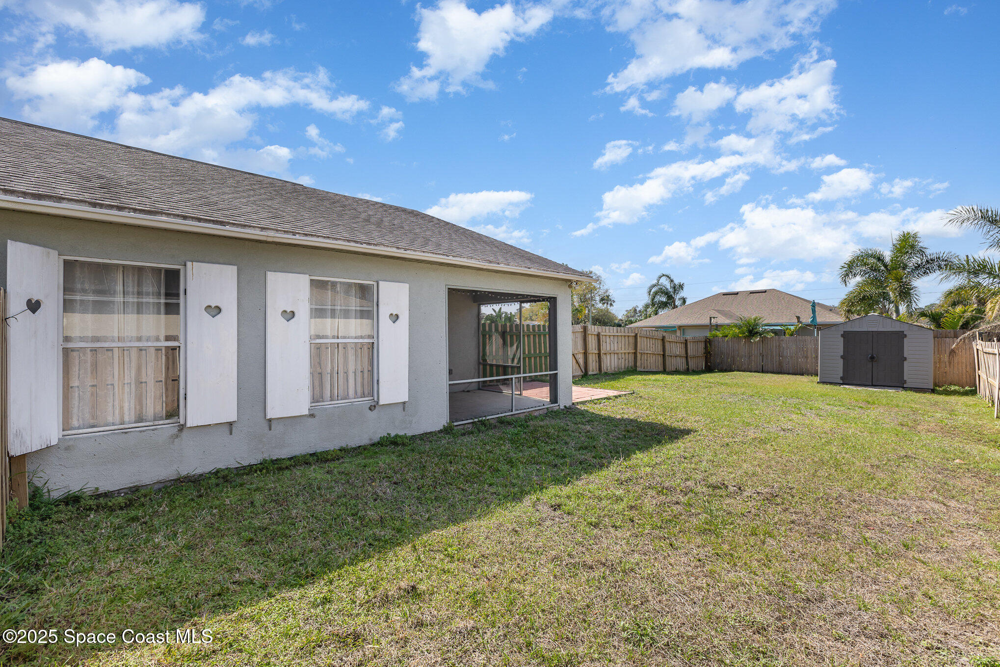 6480 Annapolis Street Cocoa, FL 32927 - Photo 27 of 30 a view of a house with backyard and porch