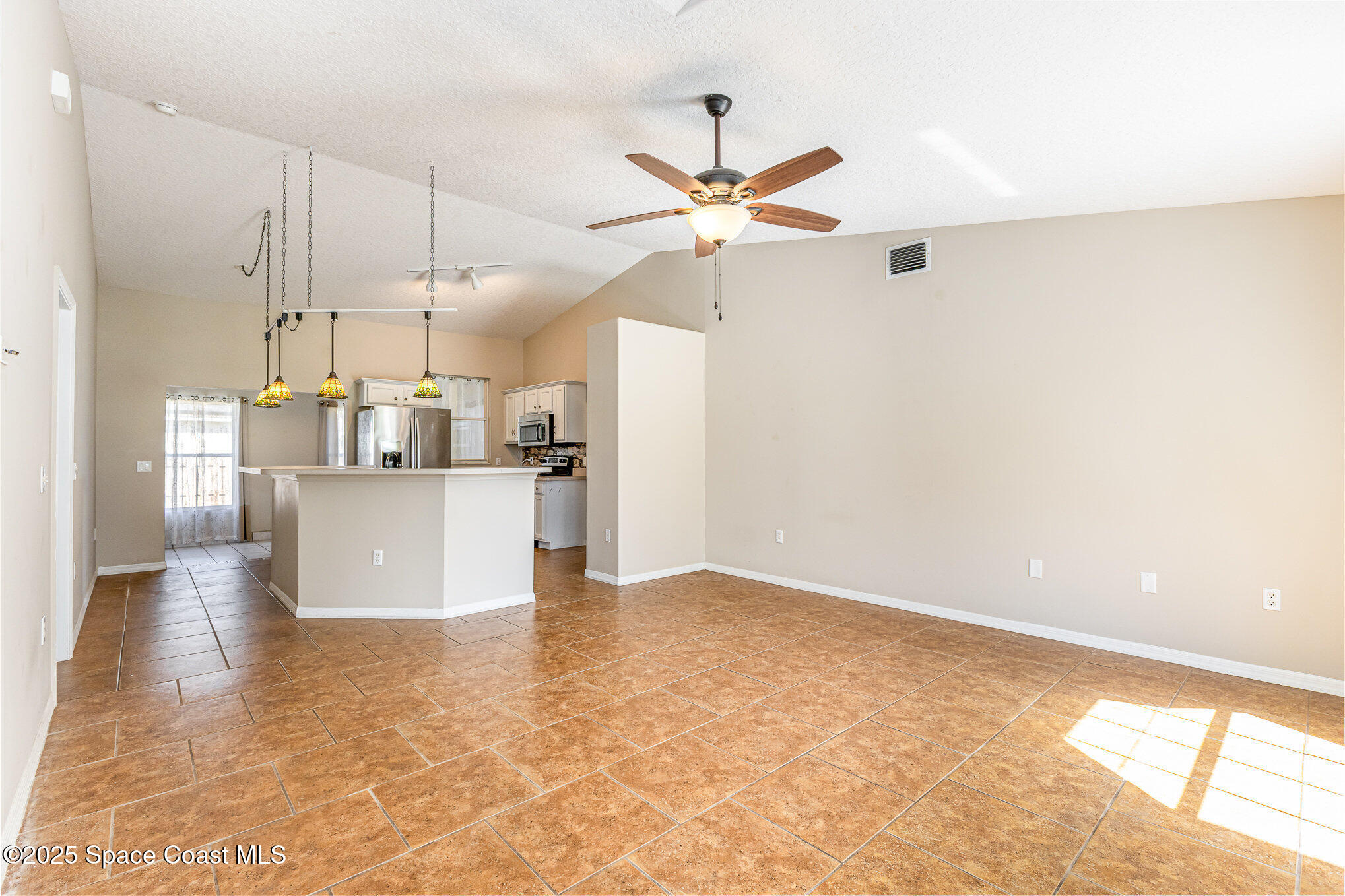 6480 Annapolis Street Cocoa, FL 32927 - Photo 5 of 30 a view of a kitchen with a sink and cabinet