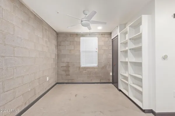 a view of an empty room with a window