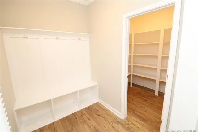 a view of walk in closet with empty racks