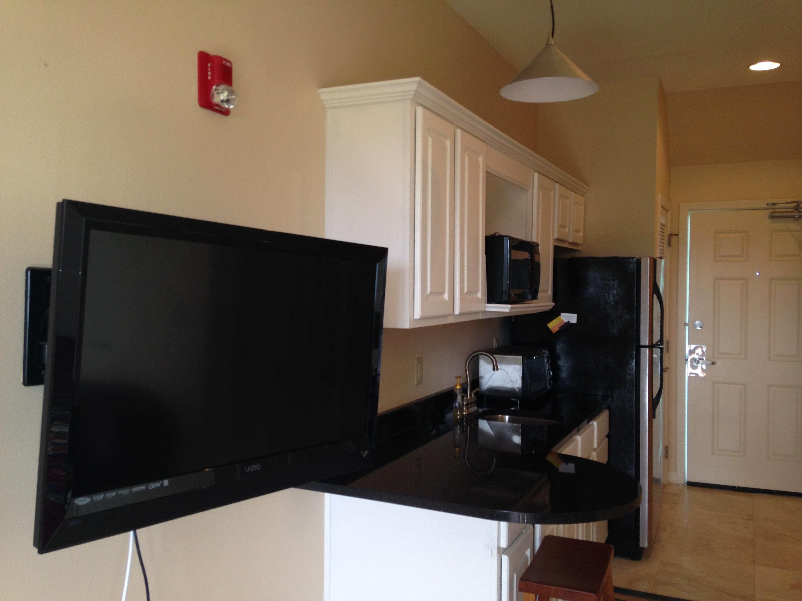 9955 Co Road, Unit 200 Seacrest, FL 32461 - Photo 12 of 17 a kitchen with a refrigerator and a cabinets