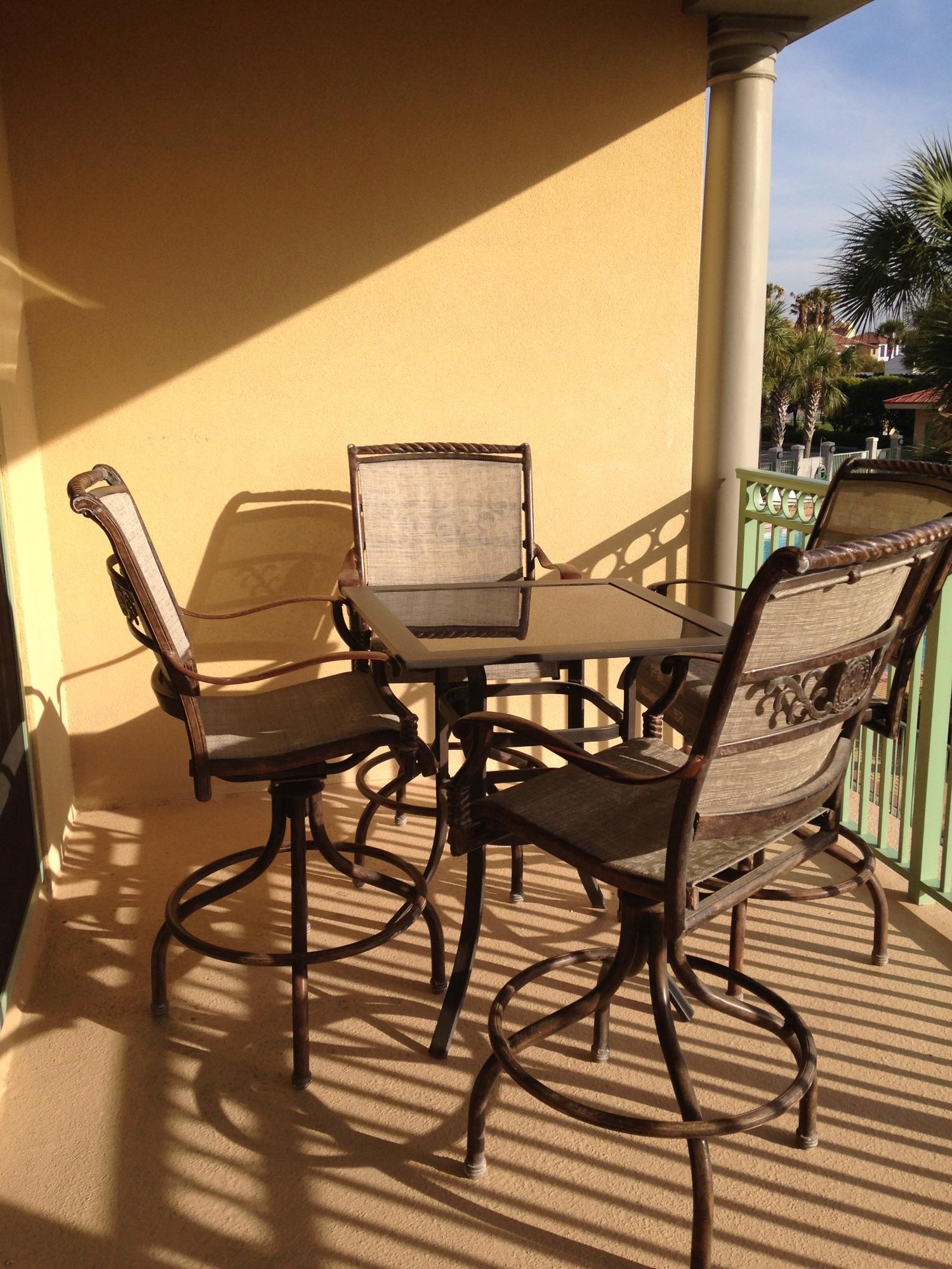 9955 Co Road, Unit 200 Seacrest, FL 32461 - Photo 6 of 17 a view of a chairs and table in the balcony