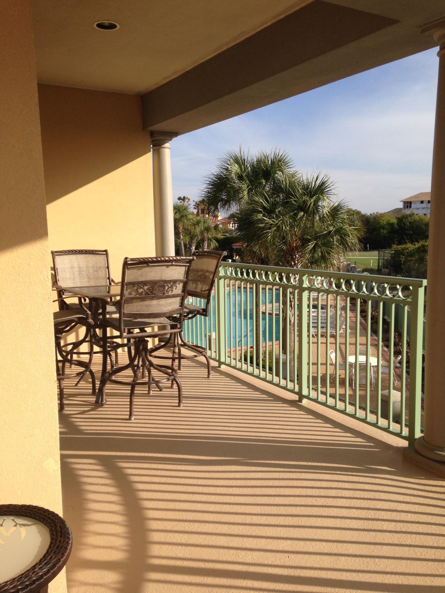 9955 Co Road, Unit 200 Seacrest, FL 32461 - Photo 10 of 17 a view of a chairs and table in patio