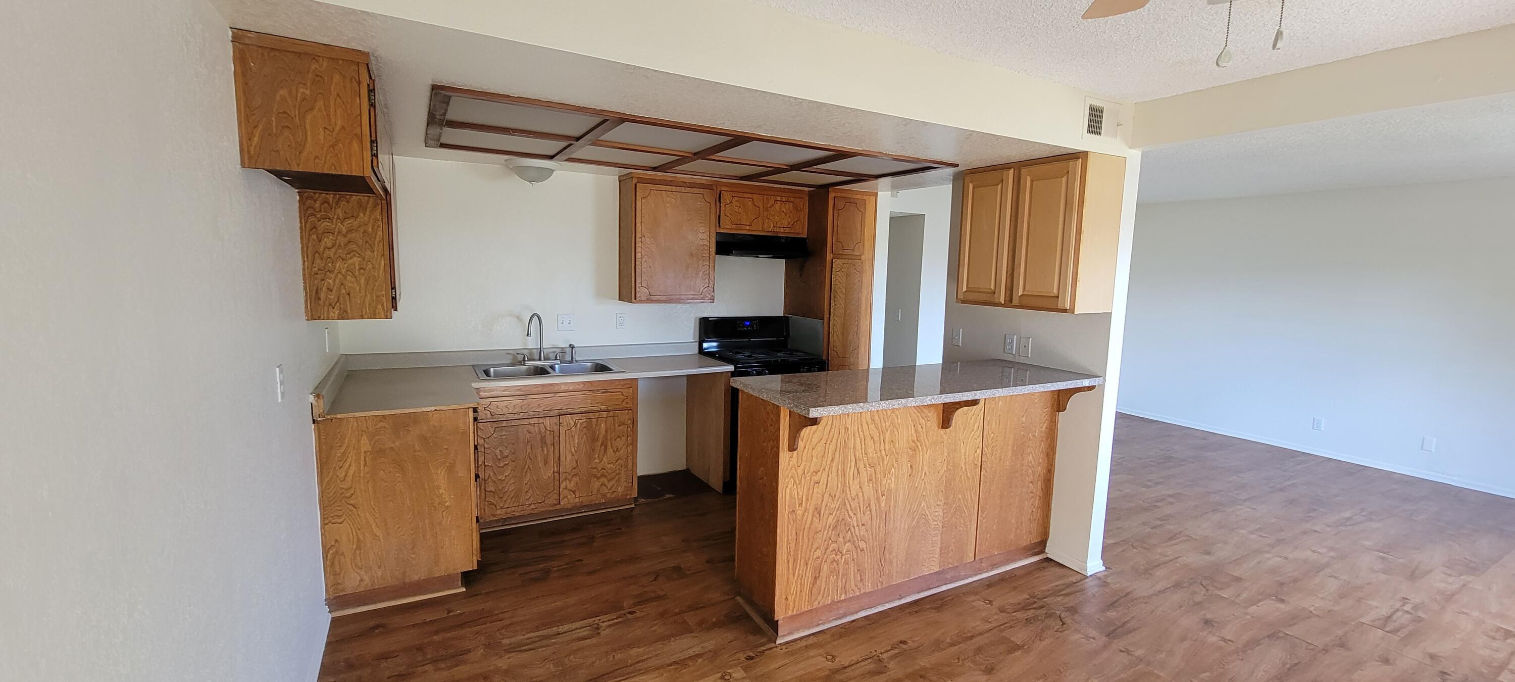 4956 5th Street Carpinteria, CA 93013 - Photo 13 of 16 a utility room with cabinets washer and dryer