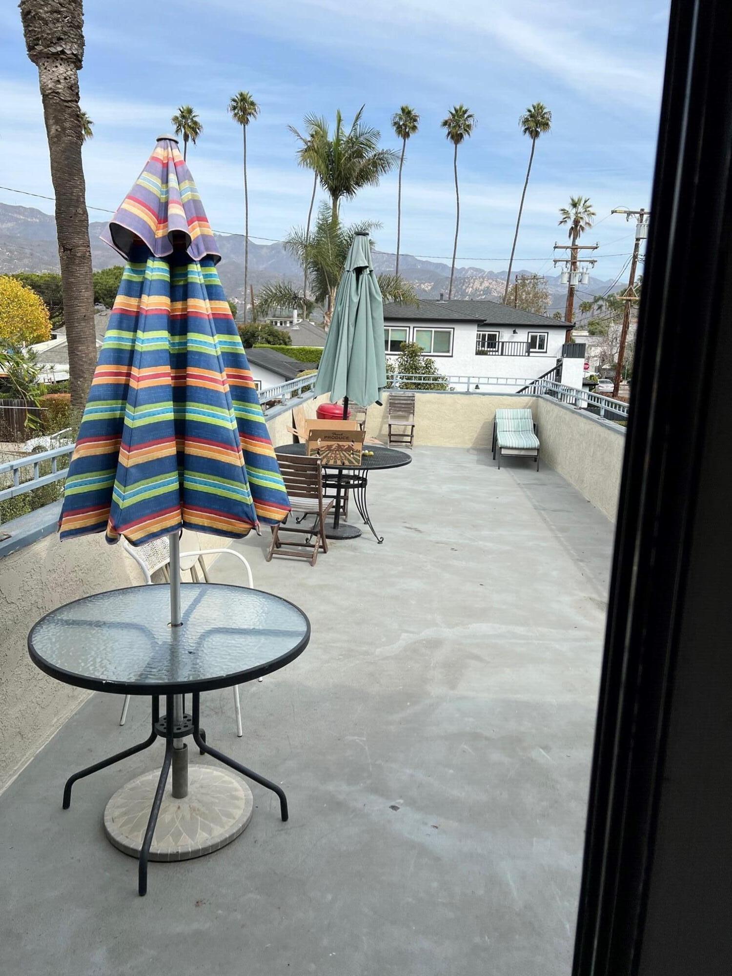 4956 5th Street Carpinteria, CA 93013 - Photo 14 of 16 a living room with furniture and a chandelier